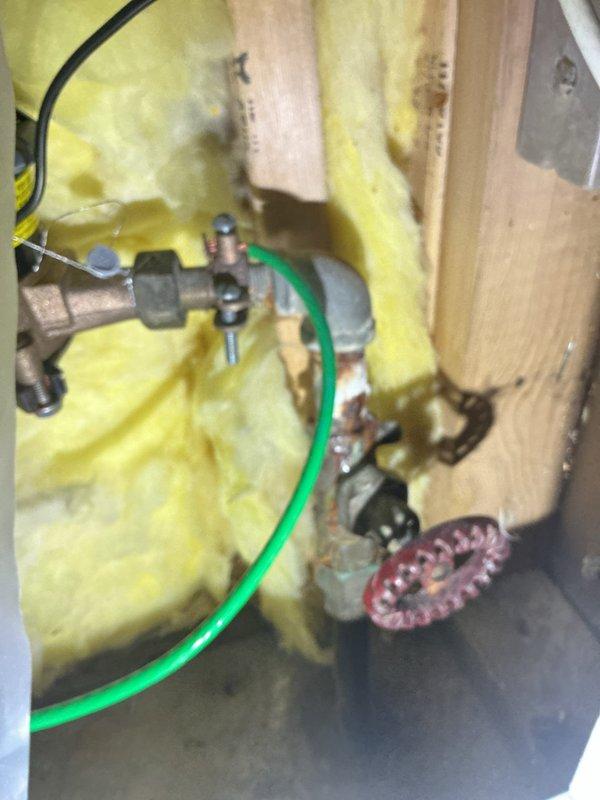 Responded to service call for malfunctioning water shut-off valve and broken vanity faucet. Upon inspection, identified clogged vanity faucet and compromised shut-off valve within wall cavity. Assessed existing plumbing infrastructure including copper supply lines, flexible supply hoses, and drain assembly, noting water staining on wooden support structures indicating previous moisture exposure. Documented conditions of wall-mounted plumbing components, insulation, and under-sink connections. Provided bid for complete vanity repipe to address underlying plumbing deficiencies and prevent future failures.