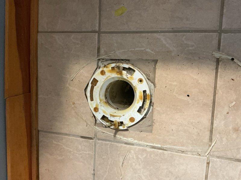 Responded to a downstairs toilet backing up and unable to drain properly. Attempted to clear the obstruction with a closet auger but was unsuccessful due to the severity of the blockage. Removed and replaced the existing toilet with a new unit. During the process, discovered the inlet of the tank was plugged with debris, which was cleared before installing the replacement fixture. Completed floor cleanup and ensured all plumbing connections were secure and functioning properly.