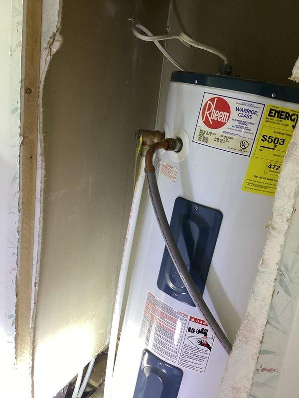 Responded to water leak service call with water shut off to home. Upon thorough inspection of plumbing system, confirmed no active plumbing leaks were present. Inspected Rheem water heater installation in utility closet area with exposed framing and verified unit connections and copper piping. Examined crawl space/basement area with exposed insulation and vapor barrier. Coordinated with drain team for separate service needs and noted HVAC system requires attention from appropriate technician.