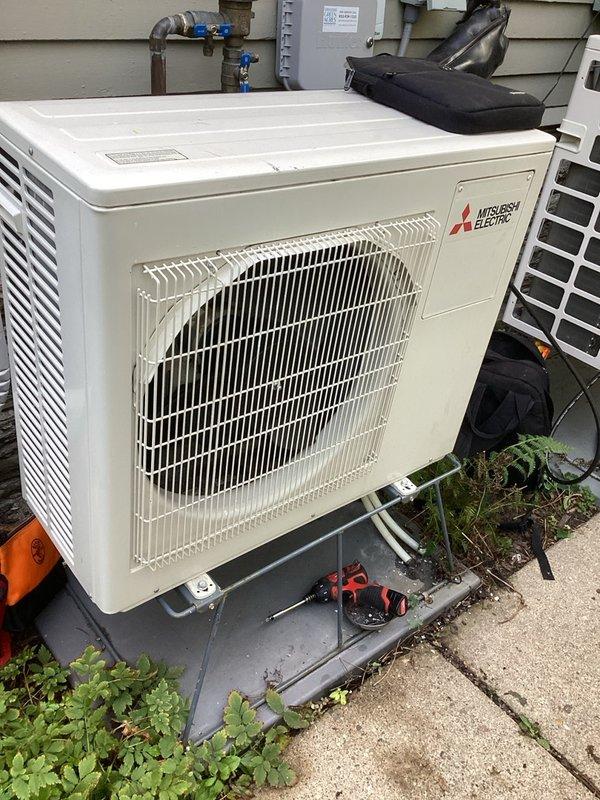 Performed warranty compressor replacement on Mitsubishi Electric mini-split system. Removed failed compressor from outdoor condenser unit, installed new compressor, and reconnected all refrigerant lines and electrical connections. Evacuated system to proper vacuum specifications, then recharged unit with 6 pounds of R-410A refrigerant per manufacturer specifications. Cycled system through complete heating and cooling operations to verify proper function of both indoor ceiling-mounted air handler and outdoor condenser unit. All components operating within normal parameters upon completion.