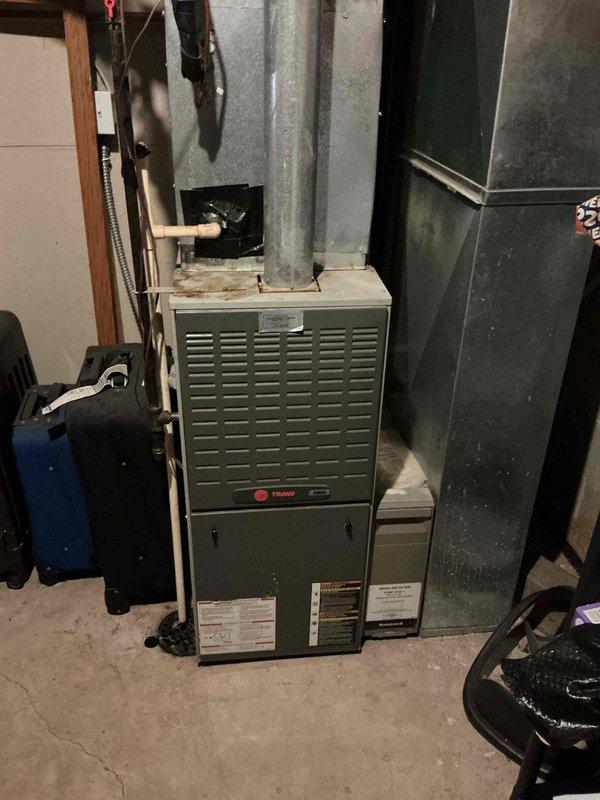 Completed comprehensive HVAC system repairs including installation of new heat exchanger in Trane furnace unit and replacement of condenser fan motor and capacitor for air conditioning system. All work performed as previously sold repair package with approximately 6 hours labor time. Upon completion, thoroughly tested equipment operation in both heating and cooling modes to verify proper system functionality and confirm all components operating within manufacturer specifications.