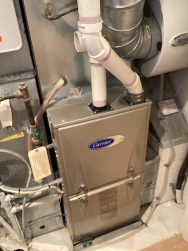 Completed scheduled Family Rewards heating maintenance visit on Carrier furnace system. Performed comprehensive system inspection including electrical diagnostics with digital multimeter, verifying proper amperage draw and voltage readings. Documented equipment make, model, and serial number information with photographs as requested. All components operating within normal parameters with no deficiencies noted at time of service.