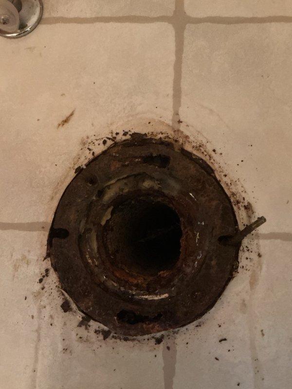 Responded to service call to inspect cast iron toilet flange prior to new toilet installation. Upon arrival, performed thorough visual examination of the existing cast iron flange and surrounding floor area. Despite visible surface corrosion and oxidation on the metal components, structural inspection confirmed the flange remains structurally sound with no cracks, breaks, or significant deterioration that would compromise its function. Mounting holes intact and flange properly secured to floor. Verified flange is suitable for supporting new toilet installation. Documented existing condition with photographs and advised customer that flange does not require replacement at this time and is adequate for proceeding with toilet installation.