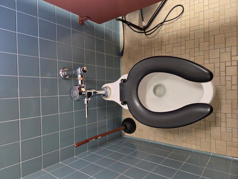 Conducted site assessment of commercial restroom facilities to evaluate plumbing issues and provide repair estimates. Inspected leaking urinal and toilet flush valve in converted female restroom, recommending replacement of two flush valve assemblies. Evaluated two wall-mounted sinks with seized cold water handles on widespread faucet installations, determining that complete faucet replacement would be necessary due to operational difficulty. Provided complimentary estimates for installation of two new flush valves and four new widespread faucets with chrome finish to restore proper function to commercial bathroom fixtures.
