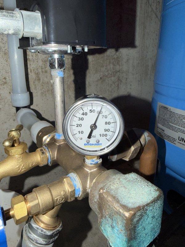Responded to callback for intermittent low water pressure issue following previous installation. Diagnosed faulty pressure switch that was sticking and causing water supply to shut off intermittently. Tested system pressure and confirmed pressure switch malfunction. Removed defective pressure switch and installed new replacement unit. Verified proper system operation and restored consistent water pressure throughout property.