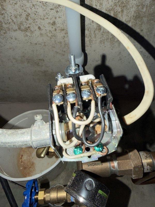 Responded to callback for intermittent low water pressure issue following previous installation. Diagnosed faulty pressure switch that was sticking and causing water supply to shut off intermittently. Tested system pressure and confirmed pressure switch malfunction. Removed defective pressure switch and installed new replacement unit. Verified proper system operation and restored consistent water pressure throughout property.