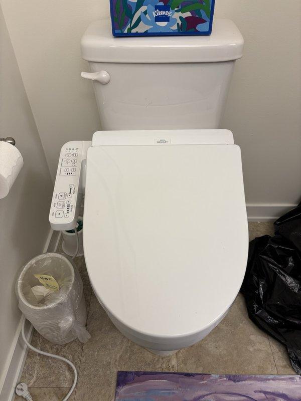 Installed customer-supplied Toto bidet washlet seat on existing toilet fixture. Connected water supply line to washlet unit and verified all connections were secure with no leaks detected after multiple flush cycles. Unable to perform full operational testing of electronic bidet functions due to lack of electrical power supply at time of installation. Washlet seat is properly mounted and plumbed, ready for use once electrical connection is established by customer. One-year parts and labor warranty provided for installation work performed; no warranty coverage applies to customer-supplied washlet unit itself.