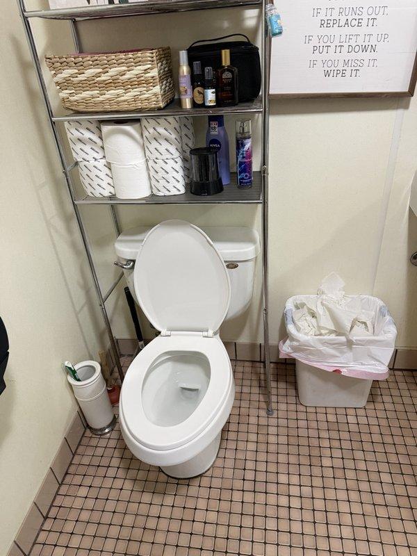 Responded to service call for toilet replacement estimate. Assessed existing standard residential toilet in bathroom with small square tile flooring. Evaluated installation requirements and provided written estimate for replacement with new ADA-compliant toilet fixture, including documentation with photographs of current conditions and plumbing connections.