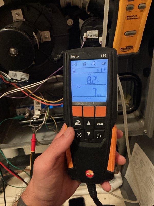 Completed comprehensive furnace tune-up on 10-year-old Lennox gas furnace system. Performed thorough maintenance including scrubbing flame sensor, flushing condensation drain line, and inspecting all critical components including capacitor, blower motor, inducer motor, electrical wiring, and heat exchanger—all found to be in good operating condition. Conducted carbon monoxide safety testing with readings at 7 ppm, which is within safe operational parameters. System is operating properly and prepared for the heating season.