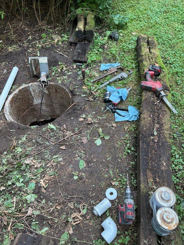 Responded to urgent service call for sewer pump replacement following recent septic tank drainage. Removed existing failed pump from concrete access pit and installed customer-supplied replacement unit. Completed PVC discharge connection modifications to accommodate new pump configuration. Upon completion of installation, customer planned to fill tank and perform operational testing to verify proper pump function and discharge flow.