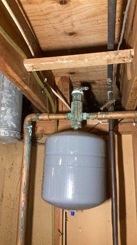 Responded to service call for corroded and leaking boiler system piping on the heating side. Shut down and drained the boiler system to perform necessary repairs. Removed and disposed of failed components including corroded piping sections and defective fittings. Installed new tee fitting, isolation valve, and vent elbow for the lower level heating zone. Replaced the Spirovent air eliminator and associated return line piping to address leaking connections. Supplied and installed new expansion tank, swing check valve, and required fittings per Minnesota mechanical code requirements. Refilled the boiler system and thoroughly purged air from all heating loops to ensure proper circulation. Tested system operation and verified all repairs were leak-free. Confirmed boiler system returned to normal operation with proper pressure and flow. Inspected work area and cleaned up all debris and old materials. All installations meet code requirements with one-year parts and labor warranty included.