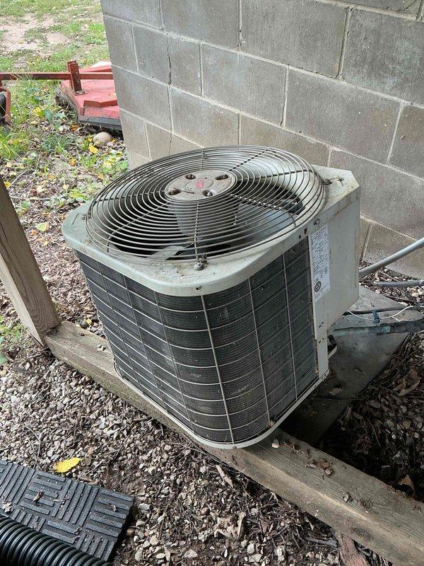 Responded to report of leak from furnace during air conditioning operation at vacant property. Performed diagnostic inspection of mobile home furnace unit and associated refrigerant lines. Operated air conditioning system for 25 minutes while monitoring all copper lines running to outdoor condenser unit and furnace connections. No condensation observed on refrigerant lines during extended runtime test. Identified that copper pipes with visible condensation run horizontally across basement area, separate from HVAC refrigerant lines. Determined moisture issue is unrelated to air conditioning system and most likely originating from nearby plumbing water lines experiencing condensation due to temperature differential. Recommended installation of dehumidifier in basement to address ambient moisture levels or consultation with licensed plumber to insulate affected water lines and resolve condensation concern.
