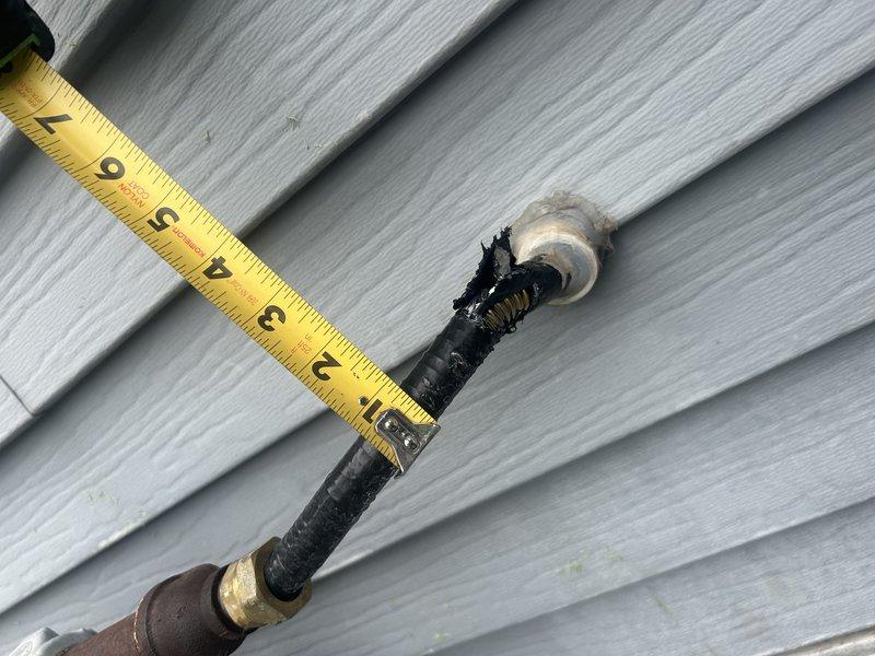 Responded to gas leak call on exterior gas line damaged by landscaping contractor. Upon arrival, performed leak detection test and visual inspection of gas piping on east side of residence. Located damage to gas line where landscaping equipment had nicked the pipe, compromising the metallic shield with a cut exceeding half an inch in length. The damage penetrated through multiple layers, exposing the bottom layer of the gas pipe structure. Documented damage with measurements and photographs showing extent of deterioration to protective coating and metallic shielding. Determined that the affected section requires removal and splicing to restore system integrity and safety. Advised homeowner that damaged pipe section must be cut out and replaced with proper gas line splicing procedures to meet code requirements. Collected diagnostic information and provided recommendations for repair scope. Follow-up pricing for gas line repair to be provided to homeowner.