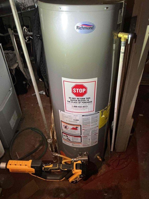 Responded to gas leak emergency at residential property where utility company had shut off gas supply and marked leak location at exterior meter elbow on southeast side of structure. Upon arrival, coordinated access through designated contact and conducted thorough inspection of exterior gas supply system and meter assembly. Identified locked gas meter and discovered multiple leak points beyond the initially marked elbow connection, requiring comprehensive assessment of the gas piping system. Documented all findings with photographic evidence showing exterior meter installation with corroded piping, connections, and fittings, as well as interior Richmond water heater and associated gas appliances. Determined that air pressure testing of the entire gas supply line system would be necessary to accurately identify all leak locations and assess the full extent of required repairs. Communicated findings to property owner by phone for approval to proceed with diagnostic air testing and provi
