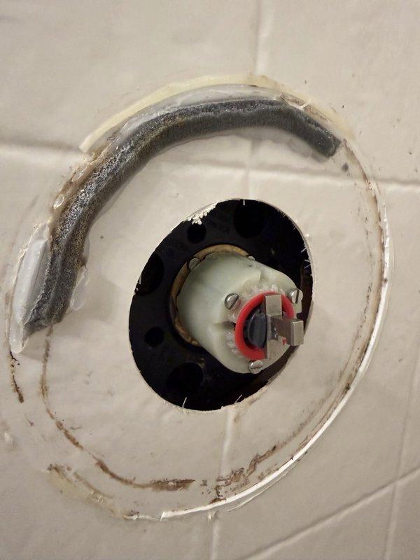 Responded to service call for continuously running toilet with no tank refill and low water pressure in upstairs shower. Upon inspection, identified failed flapper valve as cause of constant water flow. Replaced defective flapper to restore proper tank function and eliminate water waste. Investigated low pressure complaint at upstairs shower and found cartridge heavily packed with sediment, likely resulting from recent municipal water main work in the area. Removed and cleaned shower cartridge, clearing all debris to restore normal water pressure and flow rate.