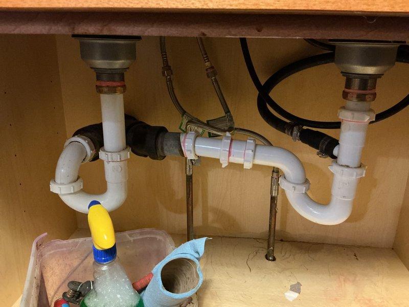 Responded to kitchen sink drainage issue with slow draining and backup conditions. Upon inspection, diagnosed blockage caused by food debris and grease accumulation in the drain line. Performed mechanical cabling of the kitchen drain line while running water to ensure proper clearing. Successfully cleared primary obstruction within the first ten feet of drain line. Continued cabling the full length of available cable run to remove any additional blockages and ensure complete drain restoration. Reassembled all drain components and conducted thorough operational testing. Verified proper drainage flow with no leaks detected at any connection points. System restored to full operational capacity.