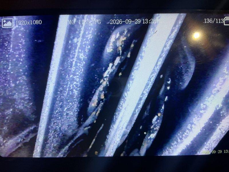 Responded to no cooling complaint on 18-year-old HVAC system. Upon inspection, discovered critical safety hazard with furnace: secondary heat exchanger rusted through from inside out, causing carbon monoxide leak during operation. Red-tagged furnace as unsafe to operate. Documented extensive corrosion and moisture damage to heat exchanger with photos. Customer elected to prioritize furnace replacement given approaching winter season and defer air conditioning repair until next cooling season. Scheduled furnace replacement estimate.