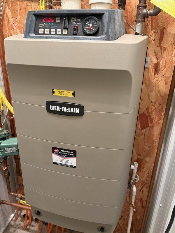 Responded to no heat call on Weil-McLain boiler in barn. Upon inspection, unit was igniting properly but shutting down prematurely. Discovered birds nest obstructing exhaust vent causing improper combustion air flow and flame rollout safety shutdown. Removed nesting material and debris from exterior exhaust piping back to unit. Interior exhaust components require cleaning with proper tooling during scheduled maintenance. Restored heat operation and recommended comprehensive boiler tune-up to address remaining maintenance needs.