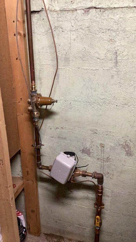 Installed a pressure reducing valve assembly to regulate and maintain safe system water pressure throughout the plumbing system. The installation included a BlueFin pressure gauge with brass fittings and compression connectors, mounted with appropriate shut-off valves for system control and maintenance access. All connections were secured using proper copper piping and brass fittings to ensure leak-free operation and accurate pressure monitoring.