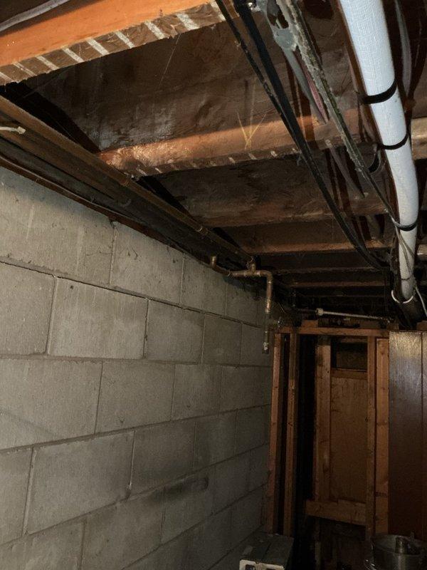 Completed comprehensive plumbing maintenance inspection of residential basement utility area as part of recurring preventive maintenance program. Inspected all accessible plumbing systems including water heater connections, PVC drainage lines, copper supply piping, and associated fixtures. Documented existing conditions of exposed plumbing infrastructure, verified proper support and securing of all piping, and confirmed water heater operational status with no immediate concerns identified at time of inspection.