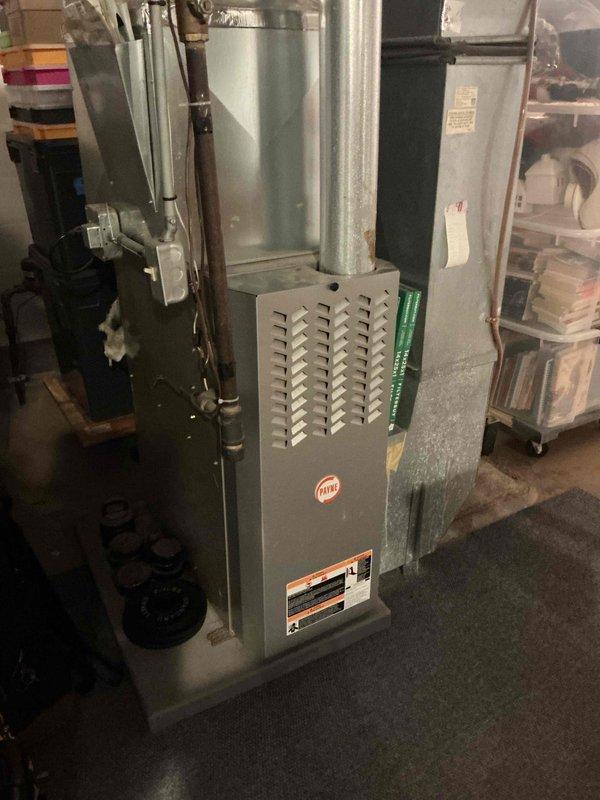 Completed annual fall heating maintenance on a 17-year-old Payne furnace. Performed comprehensive tune-up including verification of ignition and flame safety systems, gas valve operation, electrical amp draws, control board functionality, heat exchanger integrity, combustion analysis, and temperature rise measurements—all found to be within manufacturer specifications. Identified blower motor with oil leak and reviewed replacement options with homeowner.