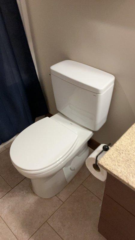 Completed installation of two standard height toilets in residential bathrooms. Each installation included new wax ring seals and closet bolts to ensure proper mounting and watertight connections. Both two-piece porcelain toilets were set on existing tile flooring with secure anchoring to the floor flange, tested for proper operation and verified leak-free performance.