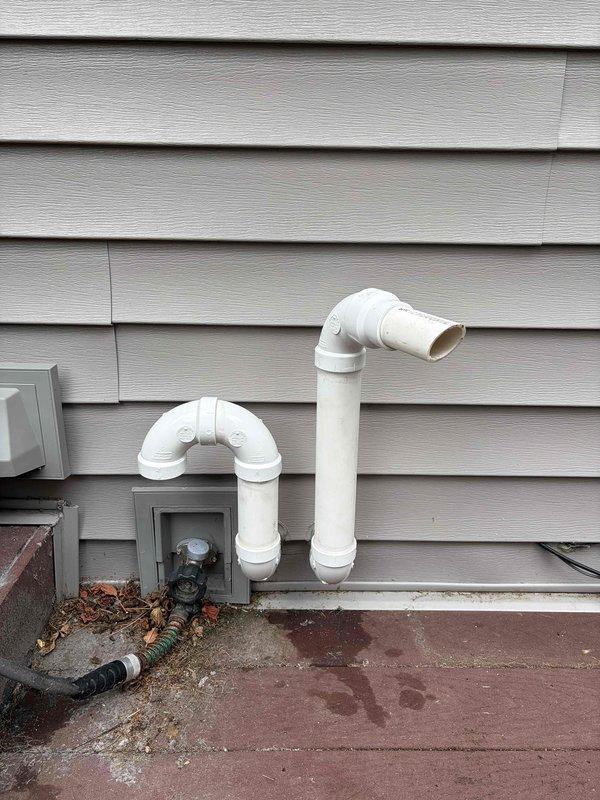 Responded to code correction callback for HVAC intake venting that did not meet SPS 323.13 (3)(b) requirements. Installed snorkel extension on intake pipe to achieve minimum 12-inch clearance above grade level. Reconfigured venting terminations on exterior wall using proper PVC fittings and mounting brackets. Verified all terminations are properly secured to siding and meet code specifications. Documented completed work with photographs showing measuring tape confirmation of proper clearance height for inspector submission.