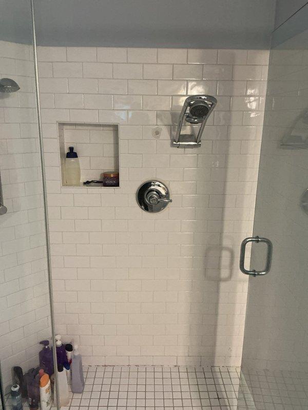 Returned to property to install customer-purchased shower fixtures including valve, trim, and multiple showerheads. Upon assessment, determined that the selected rain head products were not suitable for the application. Advised customer to return the incompatible fixtures and select alternative shower heads that would provide proper functionality and performance for the dual shower system installation.