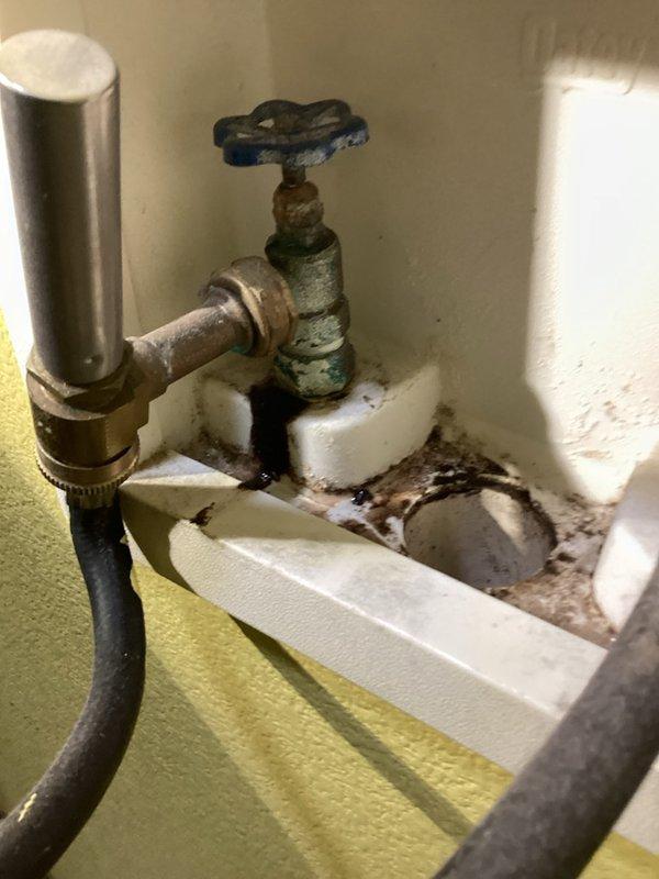 Responded to a water leak at the laundry box where the hot water shut-off valve was actively dripping. Upon inspection, found the valve exhibited severe corrosion, oxidation, and wear from long-term moisture exposure. Replaced the deteriorated shut-off valve with a new unit, resolving the leak and restoring proper water control to the washing machine supply line.