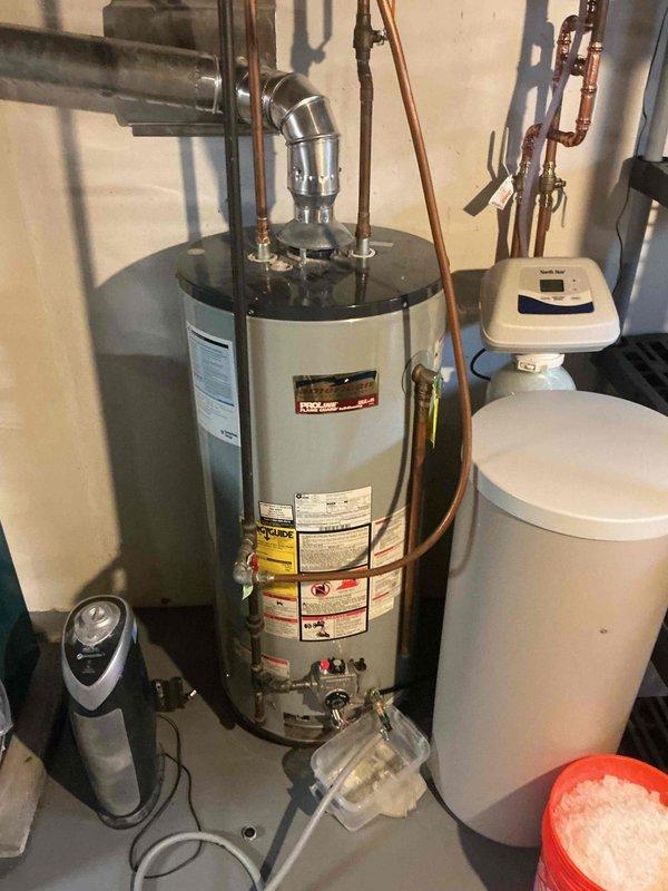 Completed comprehensive biannual plumbing inspection including full assessment of water heater, water softener system, and all associated plumbing connections. Inspected copper piping, shut-off valves, expansion tank, and water treatment equipment for proper operation and potential leaks. Verified all mechanical systems functioning correctly with no issues detected during inspection.