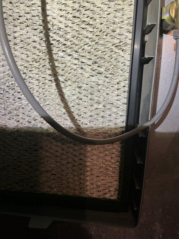 Completed annual heating maintenance on three systems: main furnace (16 years old), Aprilaire humidifier, and garage heater (2 years old). On the main furnace, scrubbed flame sensor, flushed condensation trap and pump, inspected heat exchanger, verified CO levels and gas pressure within specifications, and replaced air filter. Inspected humidifier and noted filter requires replacement; unit unable to cycle on due to indoor humidity already at 55%. Performed full inspection on garage heater including heat exchanger examination and verification of gas pressure and CO levels. All three heating systems tested operational and winter-ready.