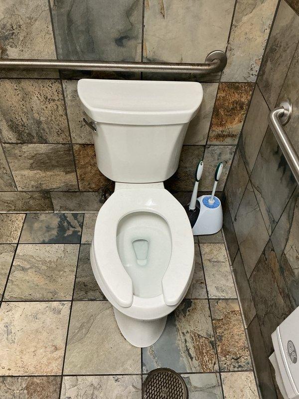 Responded to commercial property for non-flushing toilet backup. Inspected septic system and found first chamber at capacity. Ran camera line 140 feet from affected toilet fixture through drainage system with no obstructions or blockages detected in piping. Advised property management that septic tank requires pumping service to restore proper system function.