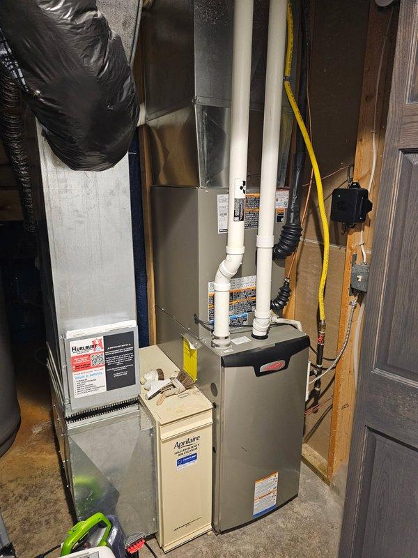Responded to urgent no heat/no cooling call on approximately one-year-old Lennox system. Found thermostat displaying Alarm ID 38 "Not Heating When Requested" error and loss of communication between thermostat and furnace. Reconfigured system settings via mobile application to restore communication link. Cycled and tested both heating and cooling operations to verify proper system functionality. Recommended thermostat replacement for long-term reliability.