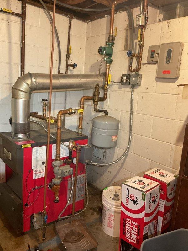 Completed comprehensive boiler tune-up on residential gas heating system, including full inspection per standard maintenance protocol. Addressed reported leak from floor drain valve and added water to system to restore proper operating levels. All components inspected and tested, including copper piping connections, expansion tank, valves, and controls. System confirmed operating properly upon completion with no safety concerns identified.