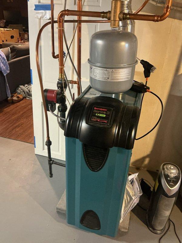Completed annual preventative maintenance heating visit on residential boiler system and two gas fireplaces. Performed comprehensive tune-up on three-year-old boiler unit, inspecting all major components including expansion tank, circulator pump, water pressure and temperature controls. Conducted combustion analysis with CO testing in flue, confirming safe operating levels. All components tested within manufacturer specifications. Adjusted gas pressure from 3.6" wc to 3.5" wc for optimal performance. Verified proper operation of expansion tank and circulator pump. System is fully operational with all safety parameters met.