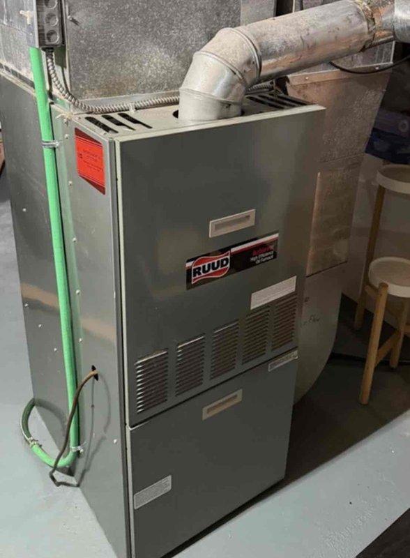 Completed comprehensive oil furnace maintenance on older Ruud unit. Replaced oil nozzle, thoroughly inspected heat exchanger for cracks or deterioration, and cleaned spark rod to ensure proper ignition. System was run and tested to verify proper operation and safe functionality following all maintenance procedures.