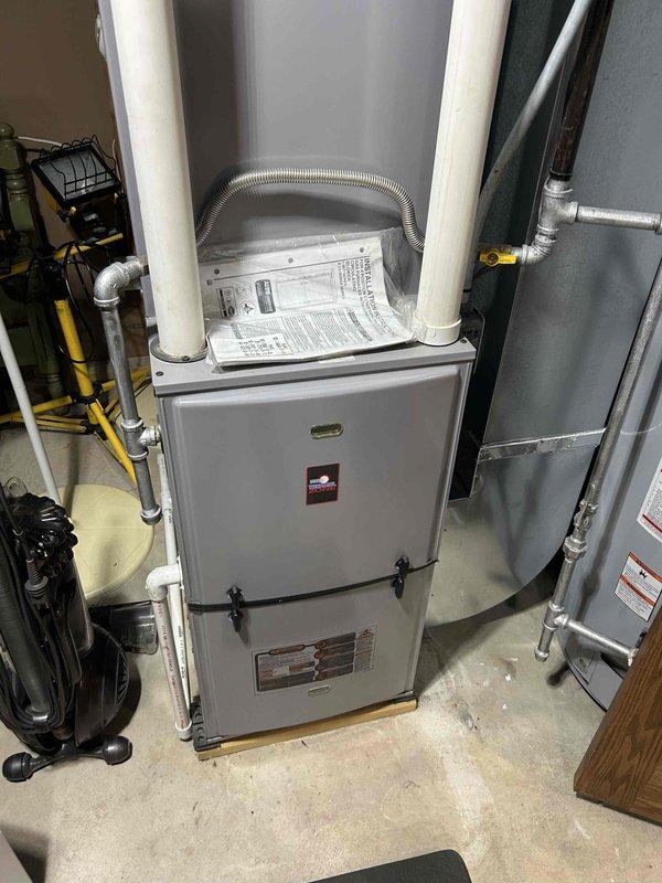 Completed comprehensive furnace tune-up and heating system inspection on residential gas furnace unit. All components including heat exchanger, burners, blower assembly, and controls were thoroughly examined and found to be operating within normal parameters. Documented equipment make, model, and serial number information with detailed photographs per service protocol, as unit age was previously undetermined. System demonstrated proper functionality during heating cycle verification with no deficiencies noted.