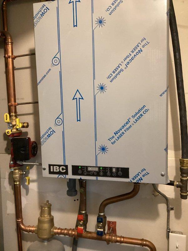 Completed scheduled heating system maintenance on ICP furnace unit as part of Family Rewards agreement. Performed comprehensive tune-up including inspection of all mechanical components, burner assembly, heat exchanger, blower motor, and electrical connections. Verified proper operation of digital thermostat control displaying 68 degrees. Inspected venting system including white PVC exhaust and intake pipes for proper installation and clearances. Checked gas connections, pressure settings, and safety controls. Cleaned and tested ignition system. Measured temperature rise and confirmed within manufacturer specifications. Inspected condensate drainage system for proper flow. All components found operating within normal parameters with no active issues reported. System running efficiently with no deficiencies noted.