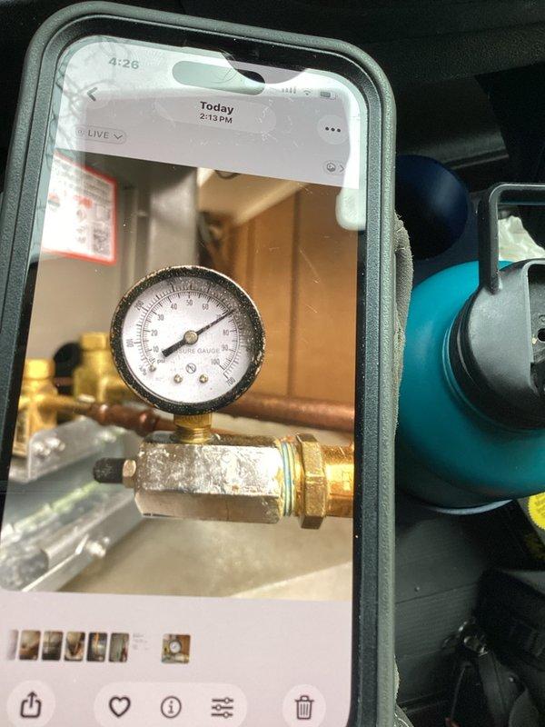 Returned to site to check nitrogen pressure on system and isolate AC refrigerant leak. Pressure test showed system dropped from 180 PSI to 140 PSI, confirming active leak. Installed three test gauges to isolate line set, A-coil, and condensing unit to determine leak location. Accessed gym area and soffit to inspect for visible leaks in line set. Due to pressure drop and leak location uncertainty, system components remain isolated with gauges in place for extended pressure monitoring at next visit to pinpoint whether leak is in line set, evaporator coil, or condensing unit before proceeding with repairs.
