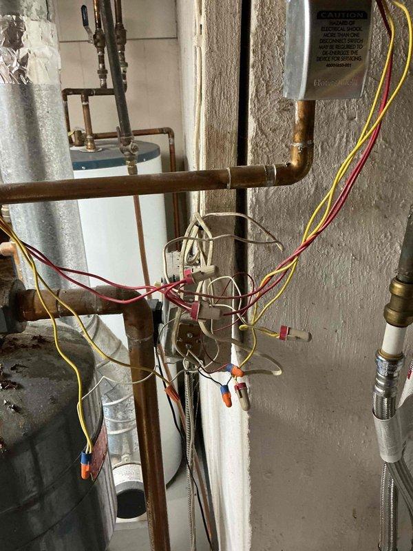 Responded to service call for boiler overheating issue. Upon inspection, discovered the boiler control valve was stuck in the open position, causing continuous heating and inability to maintain proper temperature regulation. Identified multiple leaks in the system piping and connections, with visible corrosion on expansion tank and aged copper piping assembly. Documented equipment condition with photos showing rust accumulation on tank surfaces and deteriorated plumbing components. Provided customer with detailed repair options and submitted written estimate for necessary repairs to address control valve replacement and leak remediation.