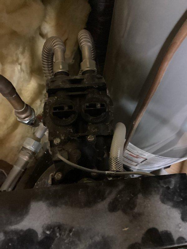 Responded to a water softener malfunction where resin beads had discharged from the unit and contaminated the entire household plumbing system, causing low water pressure and visible particulate matter in the water supply. Systematically cleared resin beads from all water lines throughout the residence, replaced two toilet fill valves, one lavatory faucet, and one shower head that were damaged or clogged by the contamination. Unclogged and flushed all remaining fixtures to restore normal water flow and pressure throughout the home.
