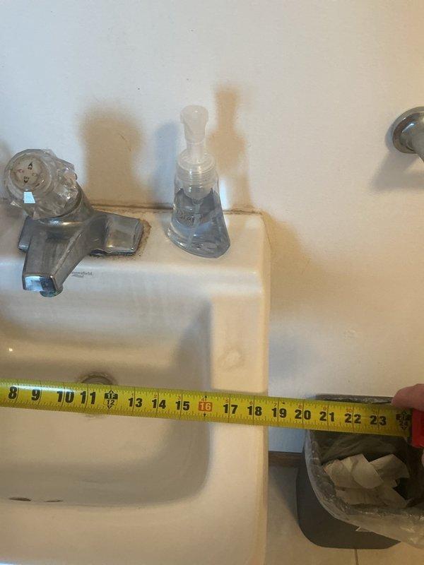 Responded to kitchen faucet leak and conducted thorough assessment of existing sink and faucet assembly. Documented precise measurements of current fixture dimensions and identified water damage on surrounding wall surfaces indicating prolonged moisture exposure. Provided detailed estimates for complete sink and faucet replacement to address the leaking issue and prevent further water damage to cabinetry and walls.