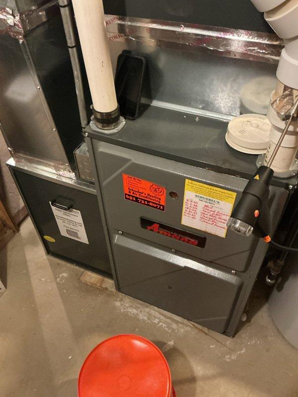 Completed annual furnace tune-up on 10-year-old gas furnace system. Performed comprehensive inspection and testing of all components, verified gas pressure within specifications, and confirmed safe CO levels in flue. Heat exchanger showed minor temperature stress but remains in good operating condition. Replaced humidifier water panel and pulled blower wheel for cleaning due to accumulated debris. All system components tested within manufacturer specifications and unit is fully operational.
