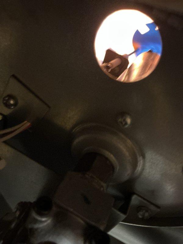 Completed comprehensive furnace maintenance and cleaning on a three-year-old Revolv heating unit installed in a mobile home. Performed full system inspection, verified proper burner operation with clean blue flame combustion visible through inspection port, and checked all electrical components including capacitor. All systems tested and confirmed operating within normal parameters with no issues identified.