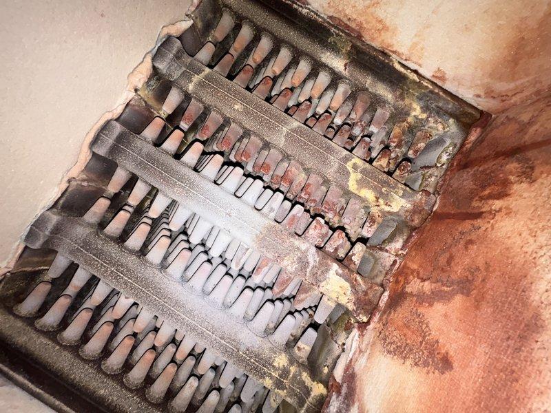 Completed comprehensive boiler tune-up including burner cleaning, heat exchanger inspection, and operational testing. Identified faulty air vent with leaking cap and malfunctioning pressure-temperature gauge with sticky needle requiring replacement, though neither issue poses immediate operational concern. Bled air from top-floor baseboard radiators, replaced thermostat batteries, and verified aquastat functionality by running system to 180°F operating temperature. Coordinated follow-up plumbing service for recently installed water filter system per customer inquiry.