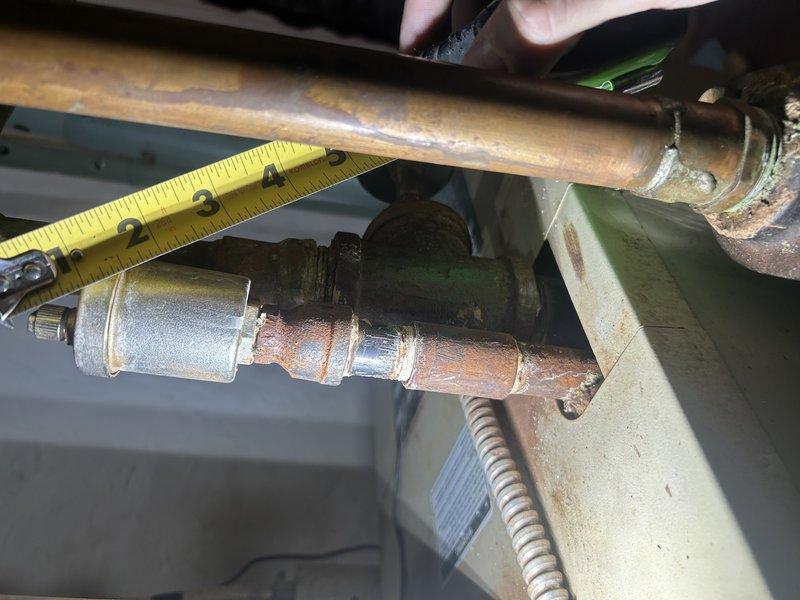 Completed comprehensive boiler tune-up including burner cleaning, heat exchanger inspection, and operational testing. Identified faulty air vent with leaking cap and malfunctioning pressure-temperature gauge with sticky needle requiring replacement, though neither issue poses immediate operational concern. Bled air from top-floor baseboard radiators, replaced thermostat batteries, and verified aquastat functionality by running system to 180°F operating temperature. Coordinated follow-up plumbing service for recently installed water filter system per customer inquiry.