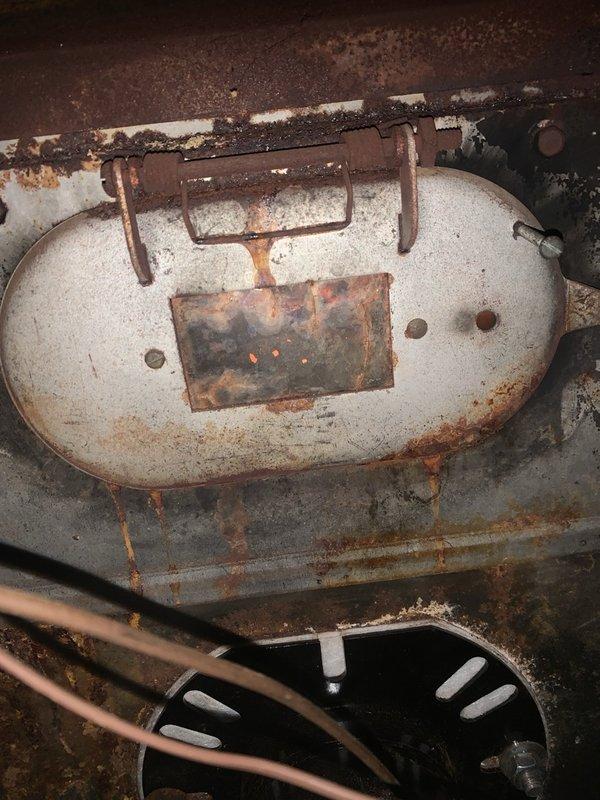 Responded to callback for oil furnace following fuel delivery that resulted in system overflow. Found fuel oil filter housing had developed pinhole leak at bottom, causing oil seepage. Replaced failed filter housing and filter assembly. Bled fuel lines to remove air from system. Inspected and verified proper condition of electrodes and burner orifice. Successfully ignited burner and cycled system multiple times from thermostat to confirm proper operation. Verified blower limit switch functioning correctly and all safety controls operating within normal parameters. System restored to full operational status.