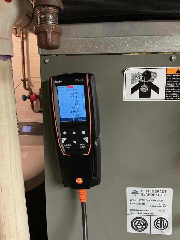 Completed comprehensive furnace tune-up on 20-year-old Lennox unit. Cleaned flame rod, verified inducer motor amperage within acceptable range, measured temperature rise at 47°F and carbon monoxide at 5 ppm. Attempted visual inspection of heat exchanger through high limit opening but access was obstructed by gas valve positioning; performed alternative inspection by inserting camera through burner section with no cracks detected. Hot surface igniter measured 19 ohms. All safety and operational parameters confirmed, unit heating and functioning properly.
