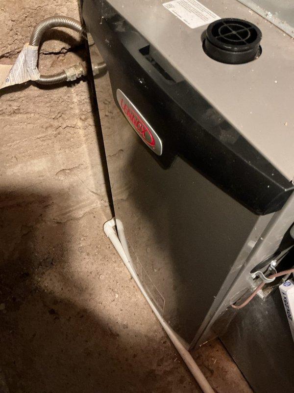 Completed scheduled heating maintenance on 8-year-old Lennox furnace as part of membership agreement. Performed comprehensive tune-up inspection and identified non-functional humidifier requiring replacement. Installed new humidifier unit and condensation pump with proper PVC drainage configuration. Noted requirement for GFI outlet installation to meet current electrical code standards for condensate pump operation. All components tested and verified operational upon completion.