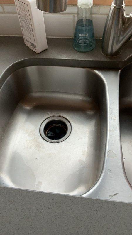 Responded to a service call for a malfunctioning garbage disposal that was not operating and actively leaking. Upon inspection, determined the unit had failed beyond repair due to corrosion and mechanical failure of internal components. Removed the existing garbage disposal unit from the sink mounting assembly, disconnected all plumbing connections and electrical wiring per code requirements, and installed a new replacement disposal. Tested the new unit for proper operation, verified all connections were secure and leak-free, and confirmed the disposal activated correctly with no unusual noise or vibration.